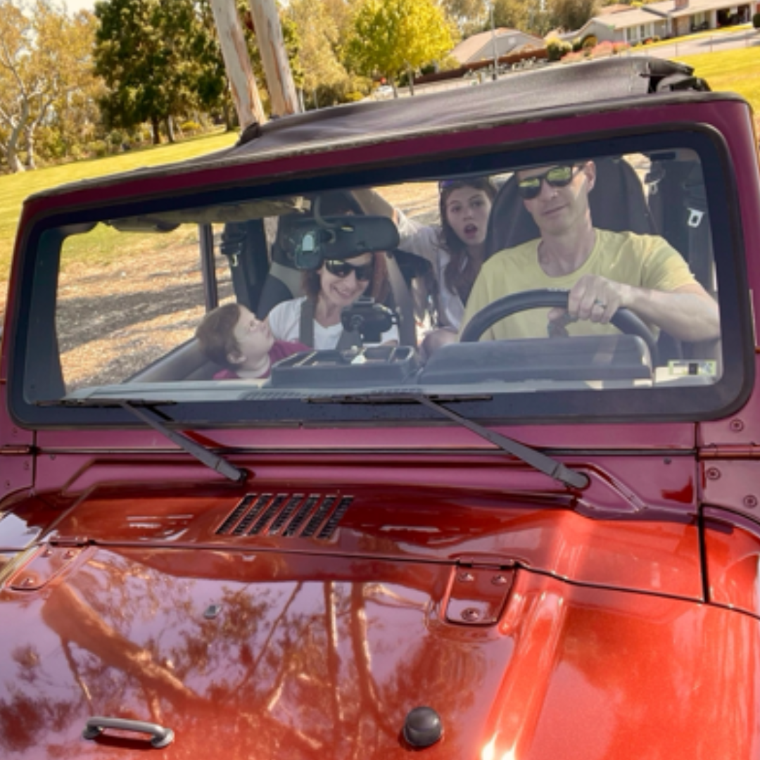 Family in Red Jeep